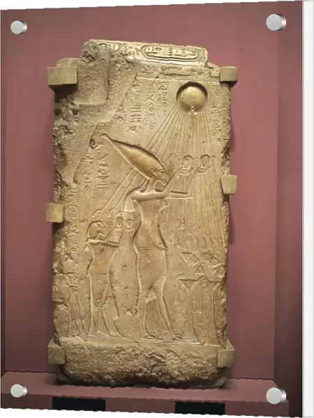 Painted limestone slab with relief depicting Akhenaton, Nefertiti and daughters worshipping the god Aton from New Kingdom