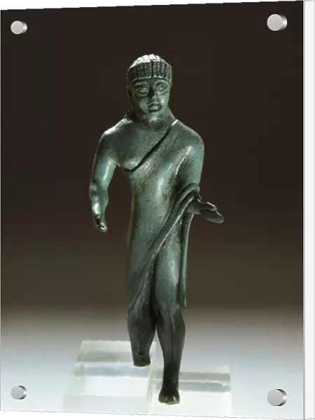 Etruscan bronze figurine of togaed man, from Villa Cassarini, Bologna, Italy, 500 B. C