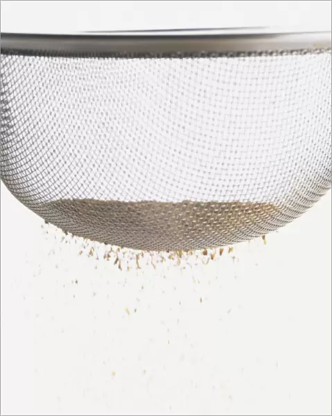 Close-up of fine powder in a sieve