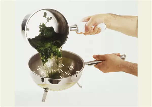 Person draining spinach