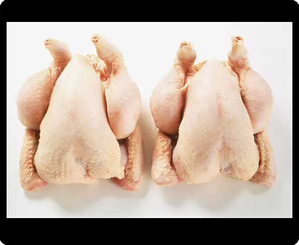 Two uncooked chickens, view from above