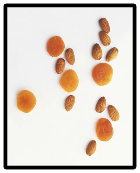 Scattered dried apricots and almonds