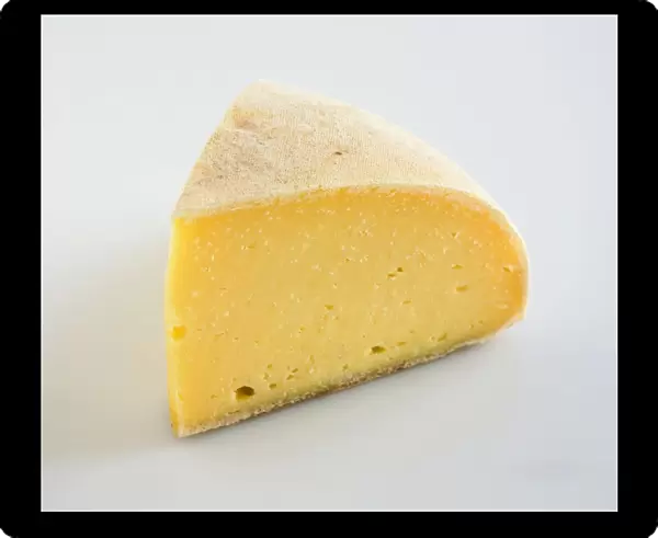 Slice of American Thomasville Tomme cows milk cheese