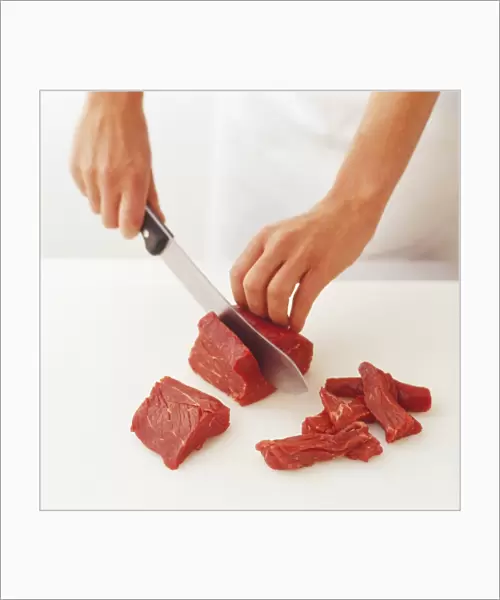 Cutting a fillet steak into strips