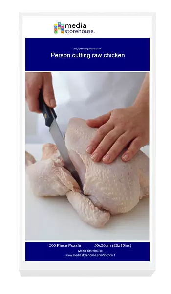Person cutting raw chicken