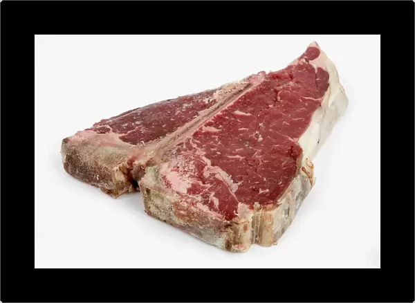 T-bone steak against white background