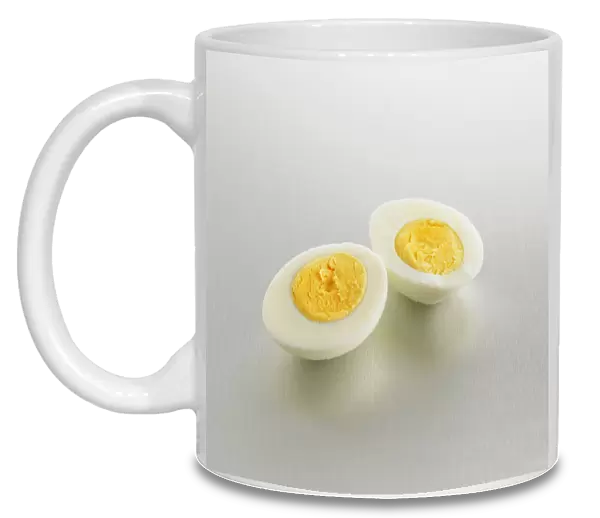Two halves showing the yolks of a hard boiled egg