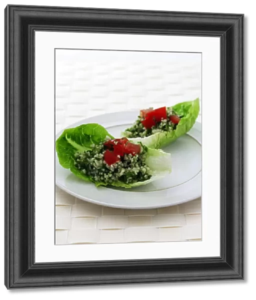 Plate of Tabbouleh on lettuce leaf, close-up