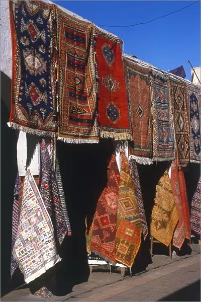 Morocco, Casablanca, Quartier Habous (New Medina), Moroccan carpets displayed for sale