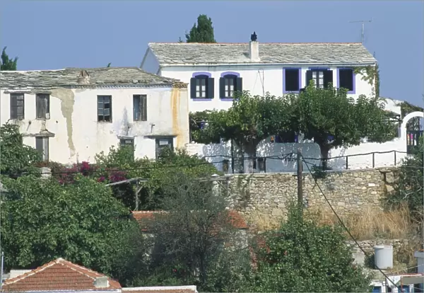 Greece, Alonnisos, two old whitewashed houses in Palaia Alonnisos in the process of restoration