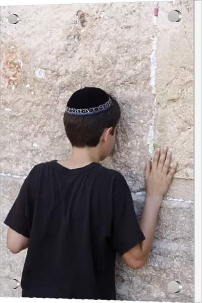 Boy praying at the Western Wall