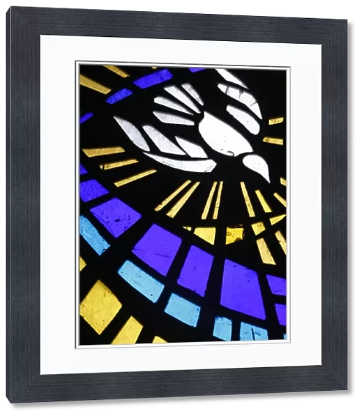 Holy ghost (dove) depicted on stained glass