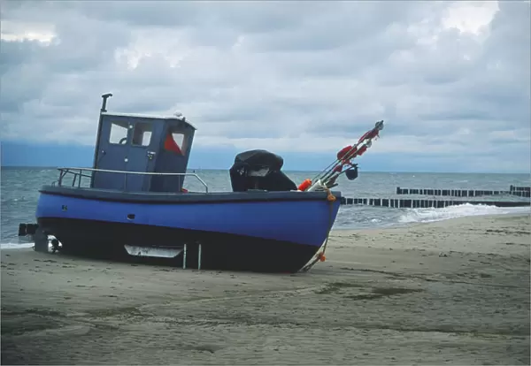 Germany, Usedom, a fishing boat on the beach