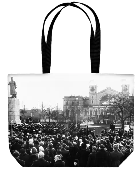 A crowd gathered for the unvailing of a new monument to joseph stalin erected in front of the baltic railway station in leningrad, november 1949