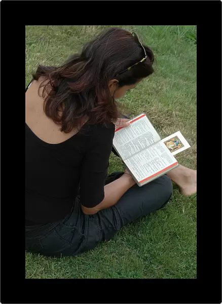 Woman reading a prayer book