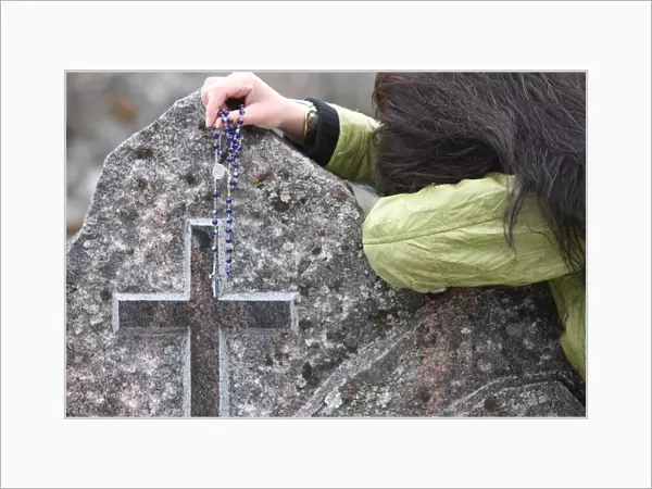 Prayer in a graveyard