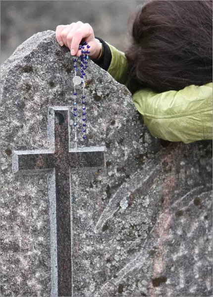 Prayer in a graveyard