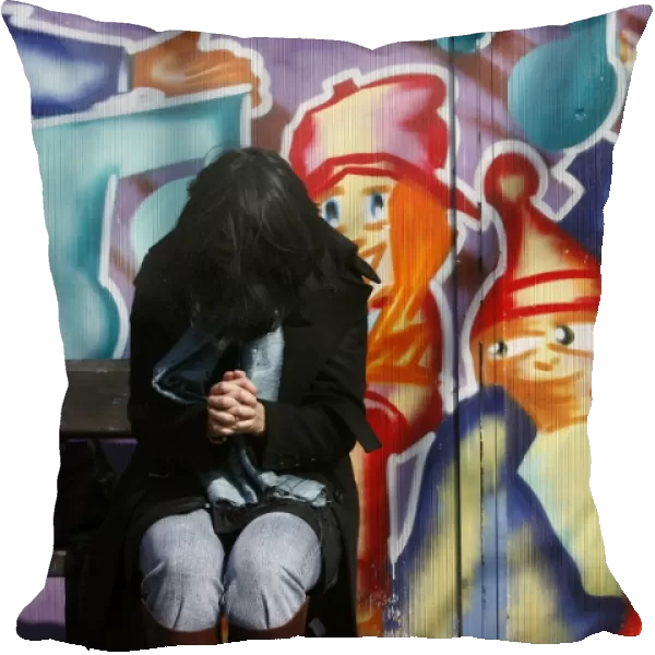 Woman praying on a bench