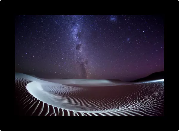 Milky Way and stars over a sand dune. Australia