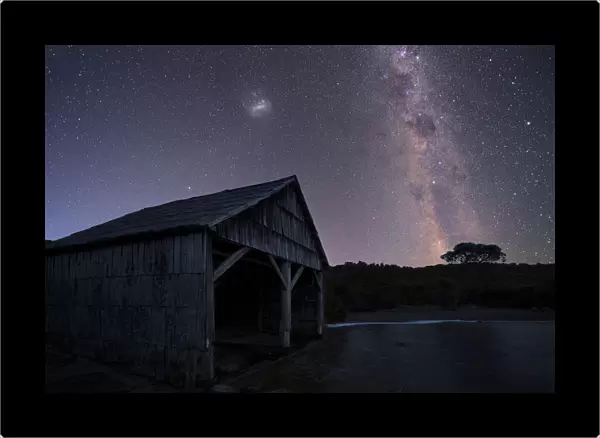 lake and boast shed under night sky tasmania