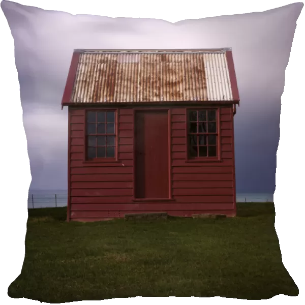 Red shed with stormy clouds