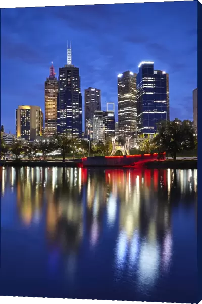 Financial district of Melbourne and River Yarra illuminated at night