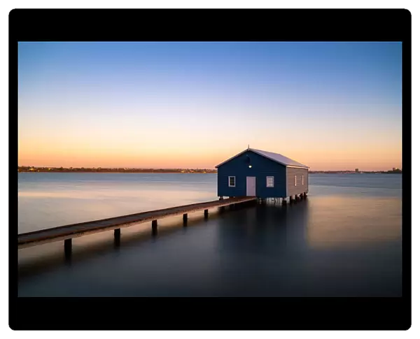 Sunset over blue boathouse in the Swan River in Perth, Western Australia, Australia