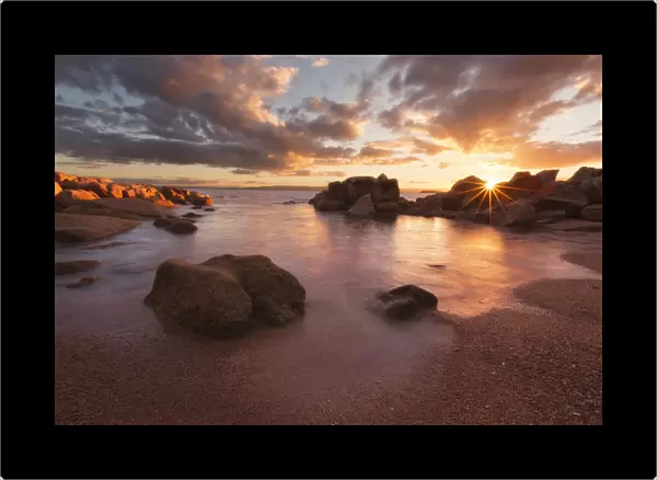 Sunset over a secluded beach in Coles Bay, Freycinet national Park, Tasmania, Australia