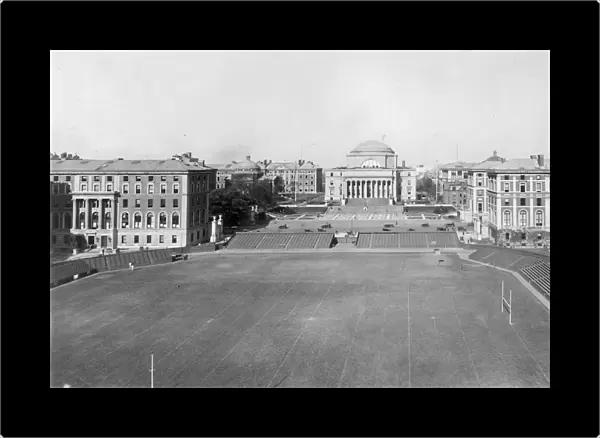 circa 1915: View of the campus of Columbia University, with the football field in the foreground