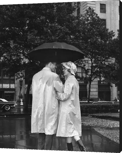 Man and woman under umbrella, color enhanced