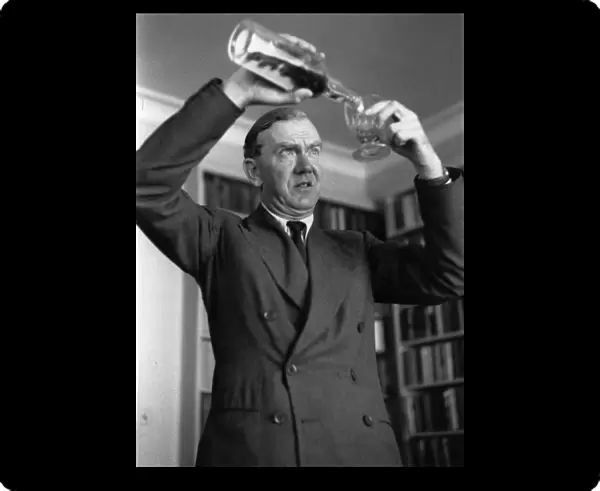 Graham Greene Pours Drink