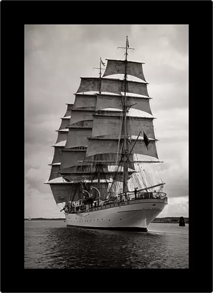 Large vintage ship under full sail