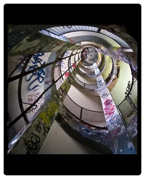 Frigos. Spiral staircase seen from above. Graffitti