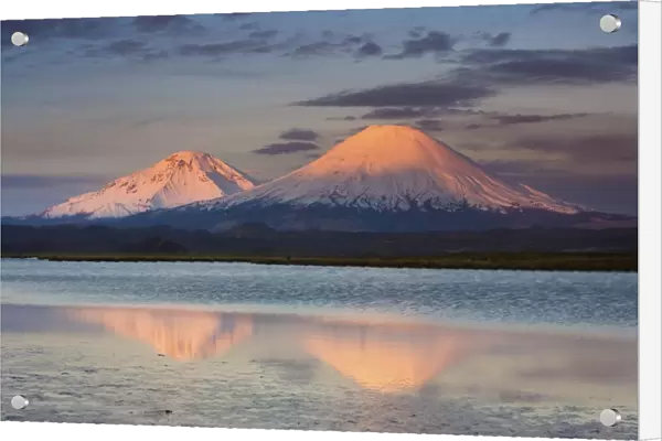 Payachata Volcanoes, twin volcanoes each standing over twenty thousand feet high, dominate the landscape in the Chilean Andes, Luaca National Park, Chile