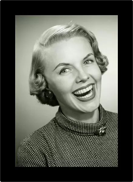 Laughing woman posing in studio, (B&W), portrait, close-up