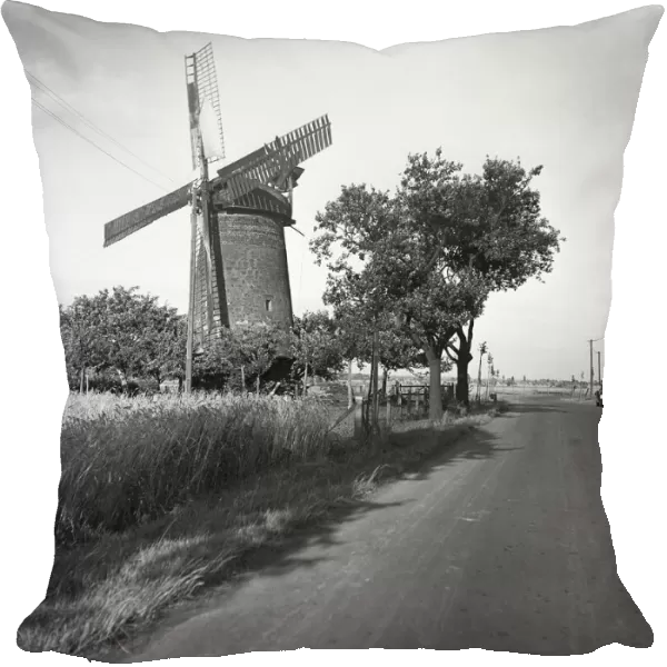 Country road and traditional windmill