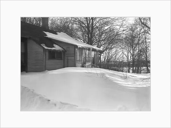 Wooden house in snow, (B&W)