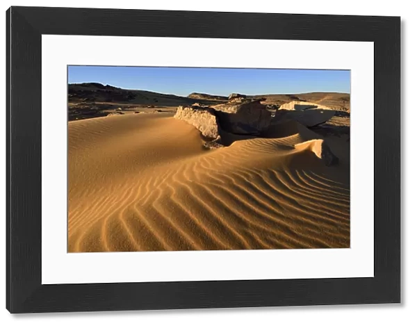 Sand dunes and sandblasted rocks on Tadrart plateau, Tassili nAjjer National Park, Unesco World Heritage Site, Sahara, Algeria