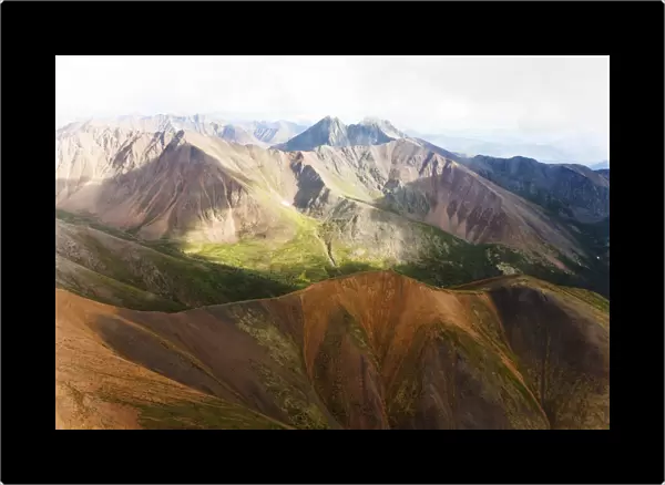 Aerial of mineral-rich Northern Mackenzie Mountains, Peel Watershed, Yukon Territory, Canada