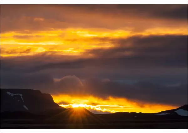 Sun breaking through the clouds, sunset, Myvatn area, Norourland eystra, Iceland