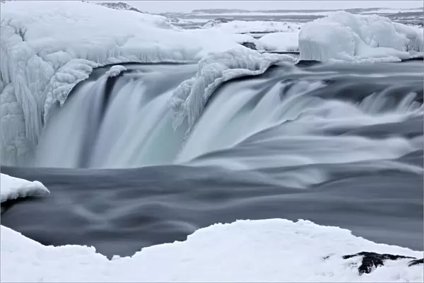 Godafoss waterfall with ice formations, Gemeinde Pingeyjarsveit, North Iceland, Iceland