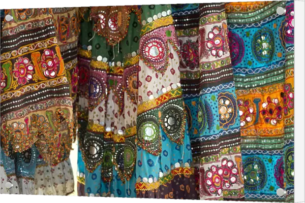 Colourful skirts inlaid with mirrors and different patterns, detail, Udaipur, Rajasthan, India