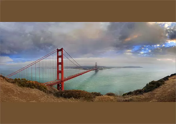 Golden Gate Bridge at sunset with storm clouds, San Francisco, California, United States