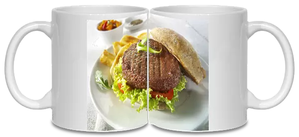 Beef burger in a wholemeal bun with salad and french fries