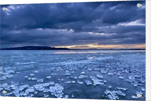 Chunks of ice lying on icy surface on the shore of Reichenau Island, Baden-Wuerttemberg, Germany, Europe