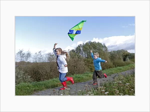 Children flying a kite, kiteflying, Hitzacker, Lower Saxony, Germany, Europe