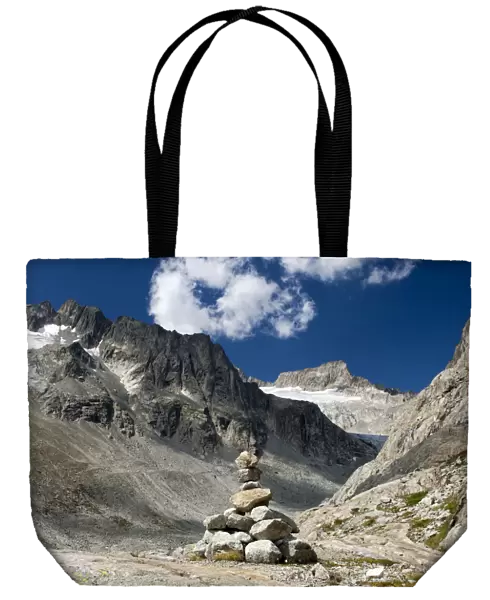 Cairn in Baechlital valley in front of Gross Diamentstock Mountain and Baechli Glacier, Bernese Alps, Switzerland, Europe