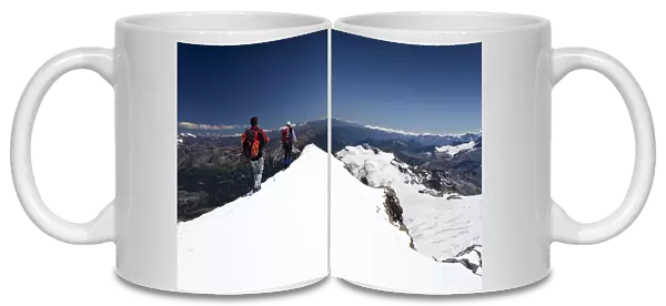 Mountaineer on the summit ridge, descent from Mt Piz Palue, Grisons, Switzerland, Europe