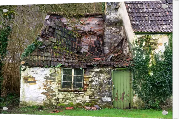 Derelict house with collapsing roof