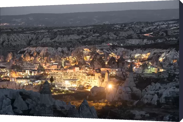 Goreme, View of cliff dwelling and village at nigh